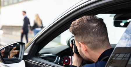 Private Detective Taking Photos Of Man And Woman Private Detective Taking Photos Of Man And Woman